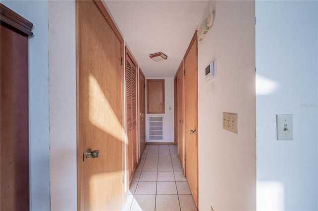 hallway with light tile patterned floors