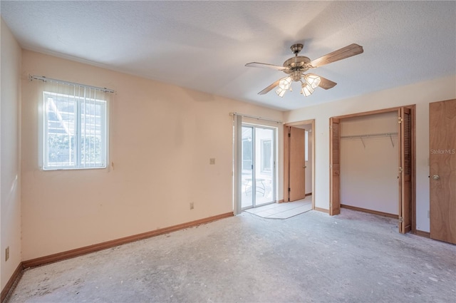 unfurnished bedroom with a textured ceiling and ceiling fan