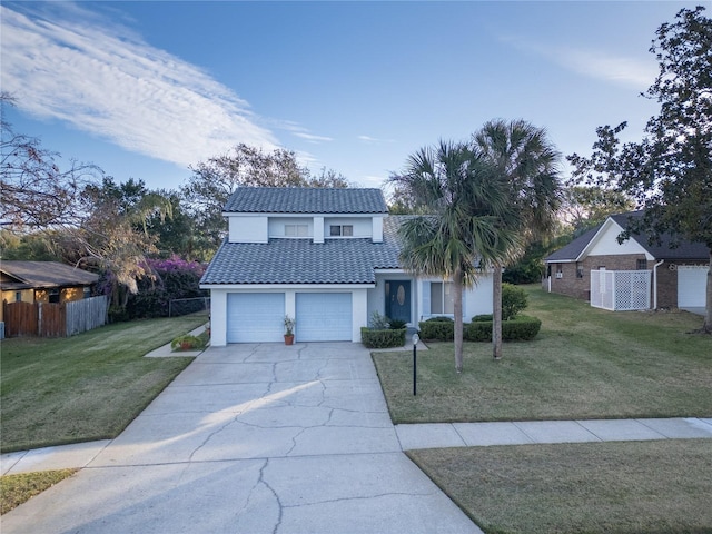 front facade featuring a garage and a front yard