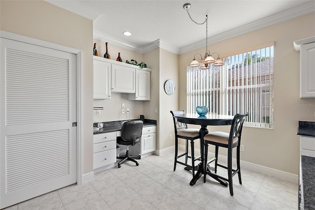 interior space featuring ornamental molding and an inviting chandelier