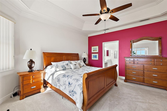 bedroom featuring light colored carpet, ensuite bath, ceiling fan, and crown molding