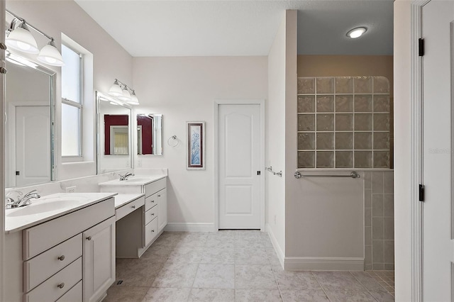 bathroom featuring tile patterned floors and vanity