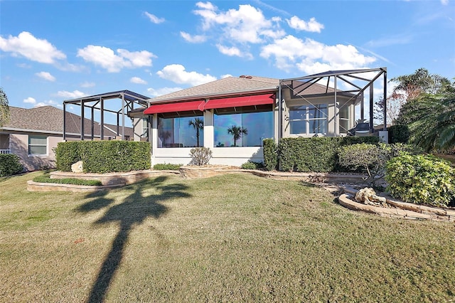 back of house featuring a yard