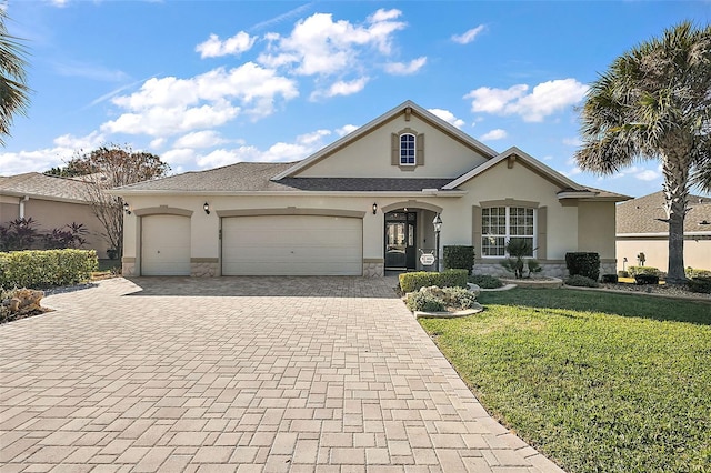 view of front of property with a front lawn and a garage