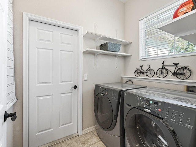 clothes washing area featuring independent washer and dryer