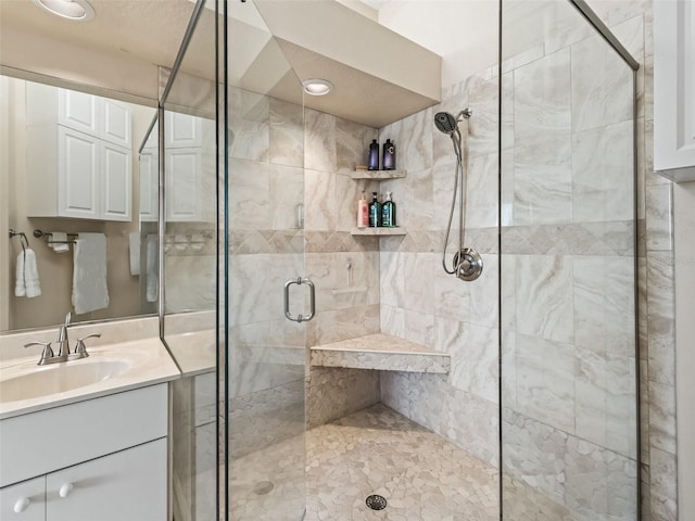 bathroom with vanity and walk in shower