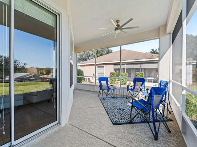 sunroom / solarium with ceiling fan