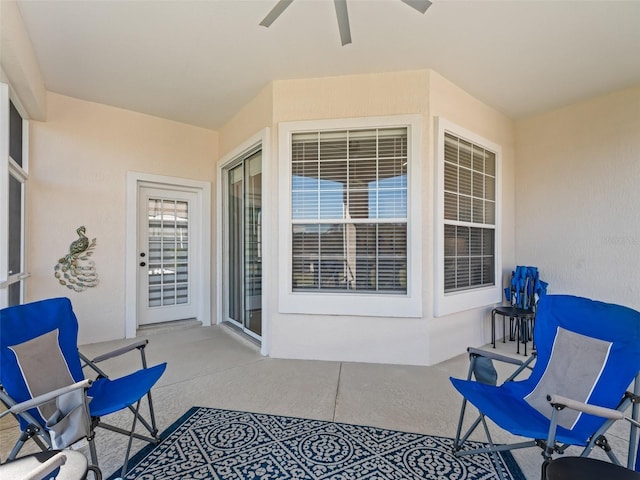 view of patio featuring ceiling fan