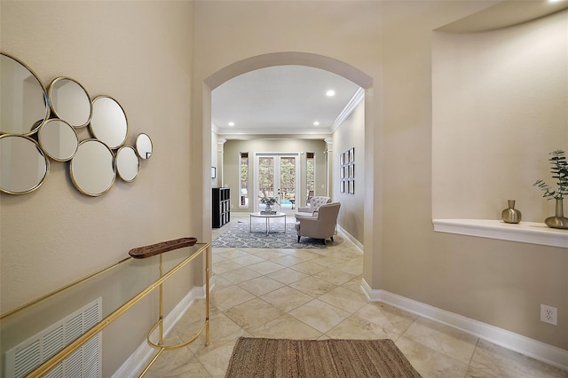 hall with crown molding and french doors