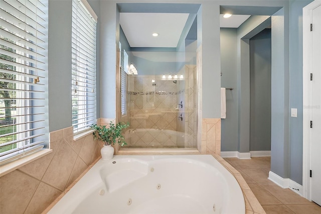 bathroom with tile patterned flooring and independent shower and bath