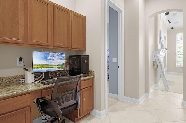 tiled home office featuring built in desk