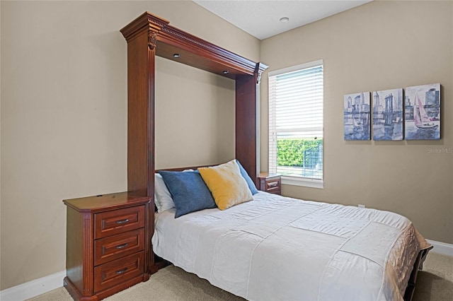 bedroom with light carpet