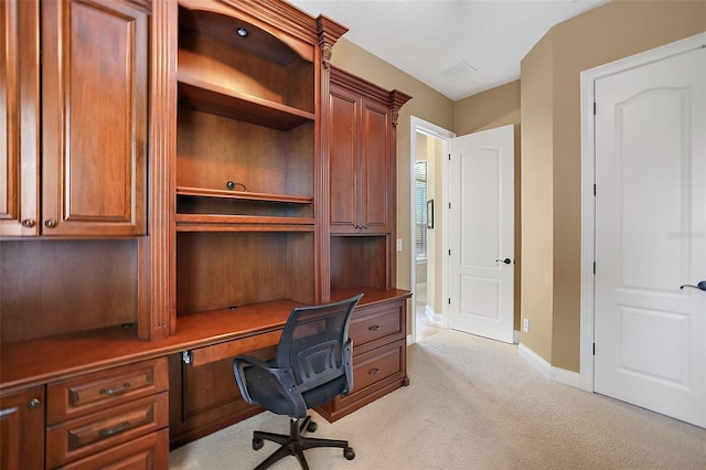 office featuring light colored carpet and built in desk