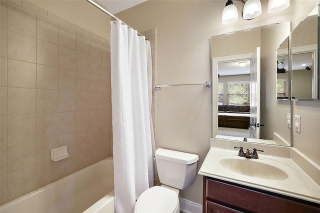 full bathroom featuring shower / bath combo, toilet, and vanity