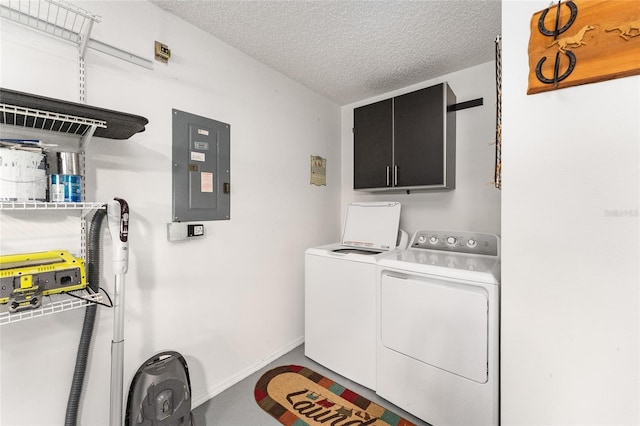 laundry area with cabinets, washing machine and dryer, electric panel, and a textured ceiling