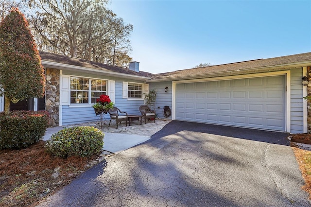 ranch-style home with a garage