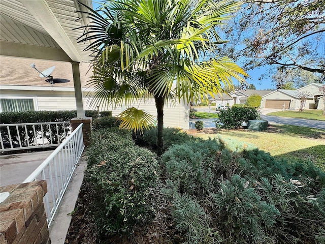 view of yard featuring covered porch