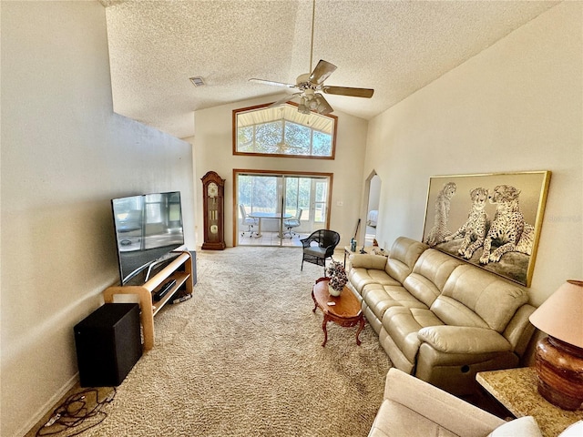 living room featuring carpet, a textured ceiling, high vaulted ceiling, and ceiling fan