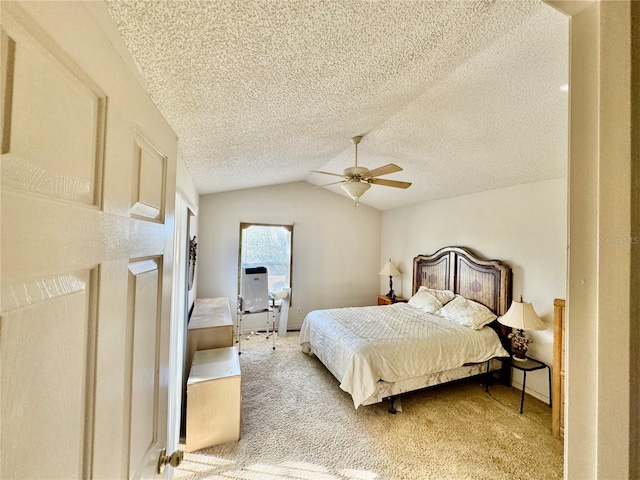 carpeted bedroom featuring a textured ceiling, ceiling fan, and vaulted ceiling