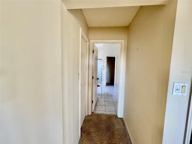 hallway with light tile patterned floors