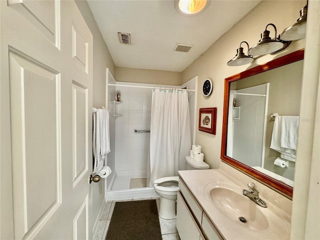 bathroom featuring tile patterned floors, toilet, vanity, and a shower with shower curtain