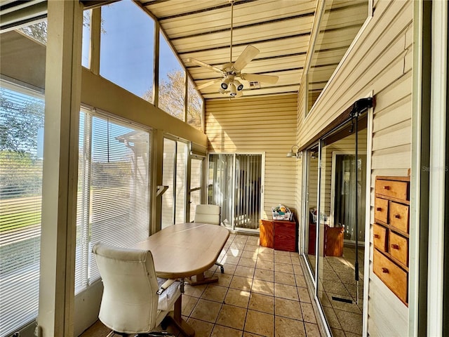 sunroom / solarium with ceiling fan, lofted ceiling, and wood ceiling