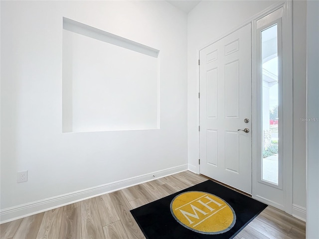 foyer with light wood-type flooring