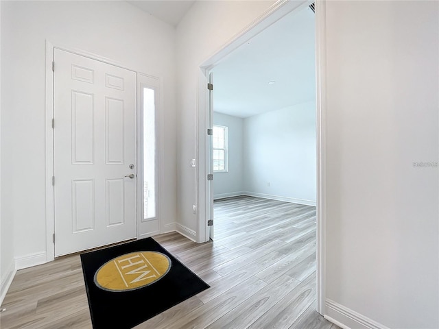 foyer with light hardwood / wood-style floors