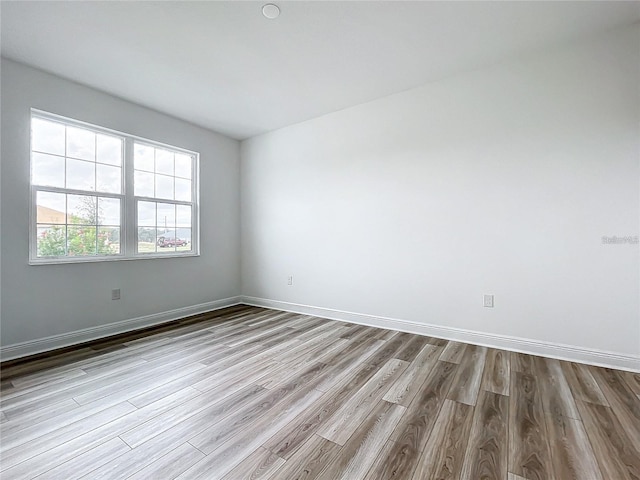 unfurnished room with light hardwood / wood-style flooring