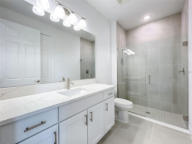 bathroom with tile patterned flooring, vanity, and an enclosed shower