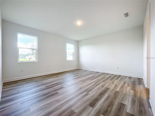 empty room featuring hardwood / wood-style flooring