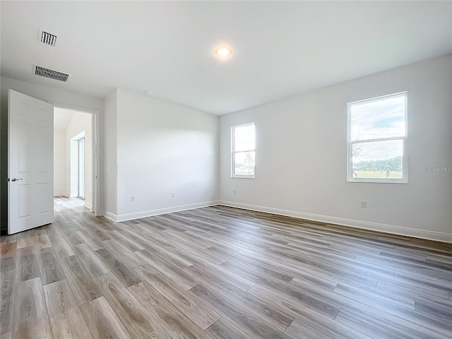 spare room featuring light wood-type flooring