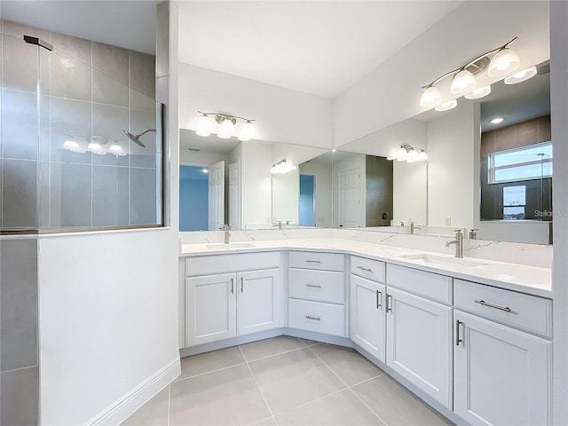 bathroom with tile patterned floors and vanity