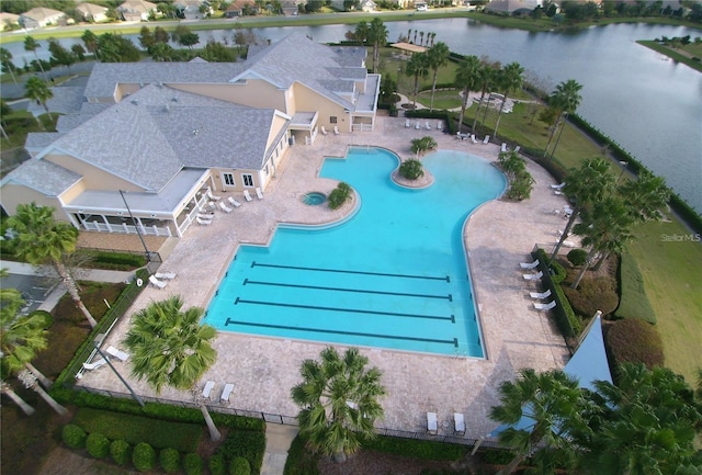 view of swimming pool featuring a water view