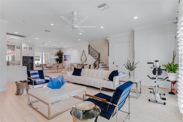 living room featuring crown molding, ceiling fan, and light tile patterned floors