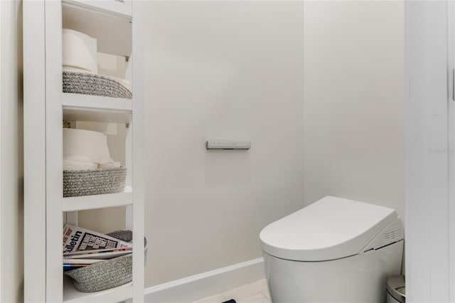 bathroom featuring toilet and tile patterned flooring