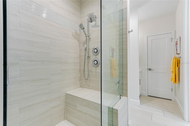 bathroom with tiled shower