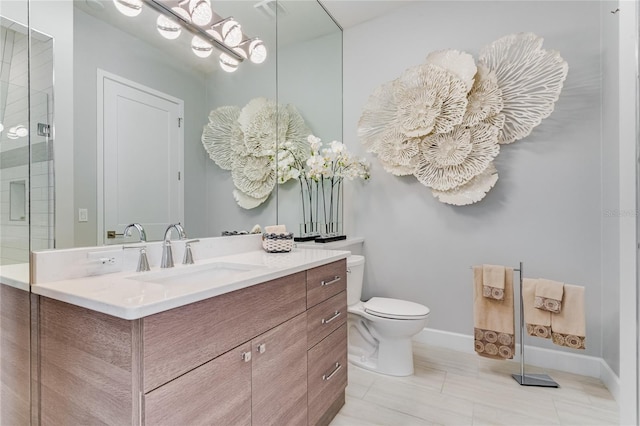 bathroom featuring vanity, toilet, a shower with shower door, and tile patterned flooring