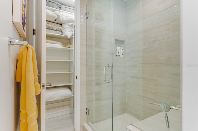 bathroom with a shower with shower door