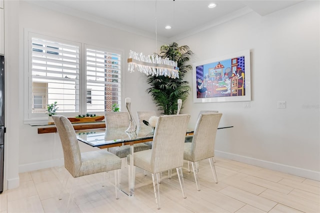 dining area featuring crown molding