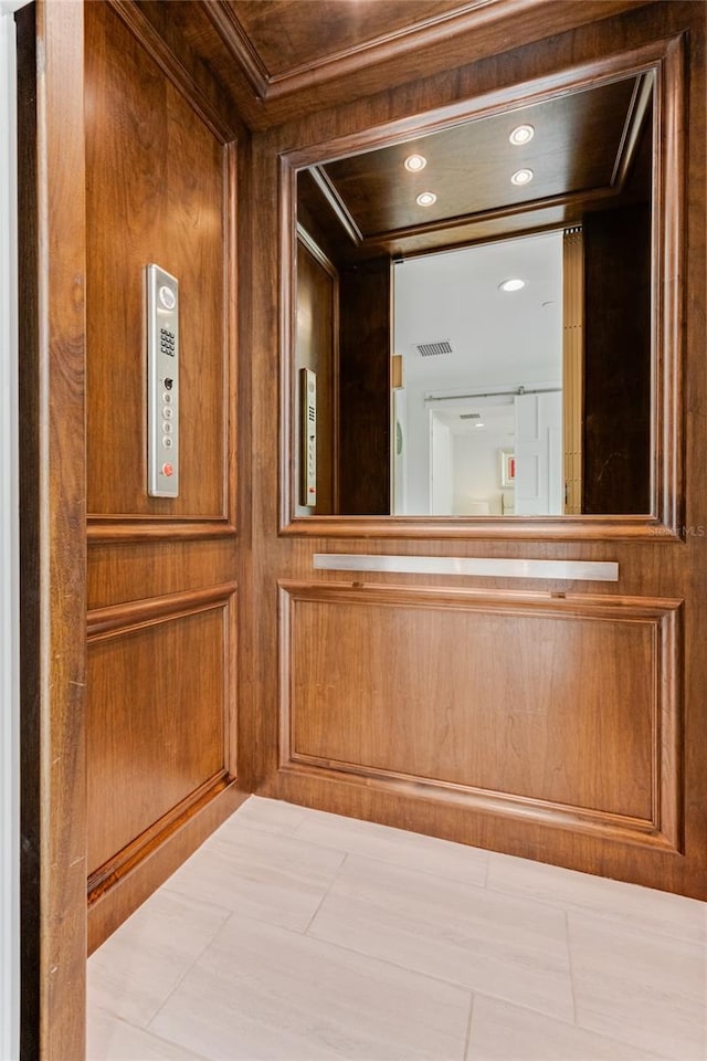 room details with elevator and wood walls