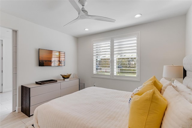 bedroom featuring light tile patterned floors and ceiling fan