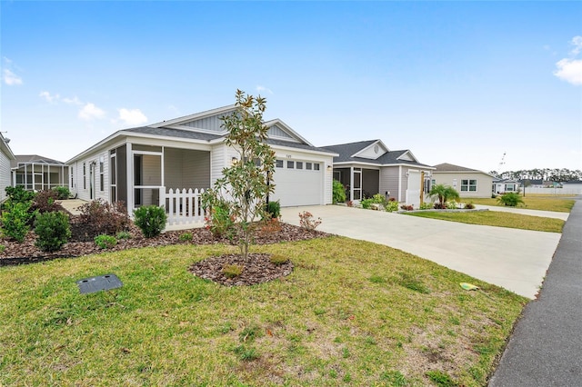 single story home featuring a front yard and a garage