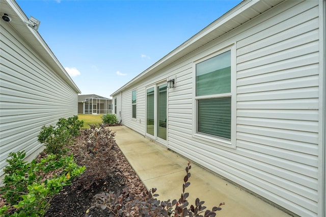 view of side of property with a patio