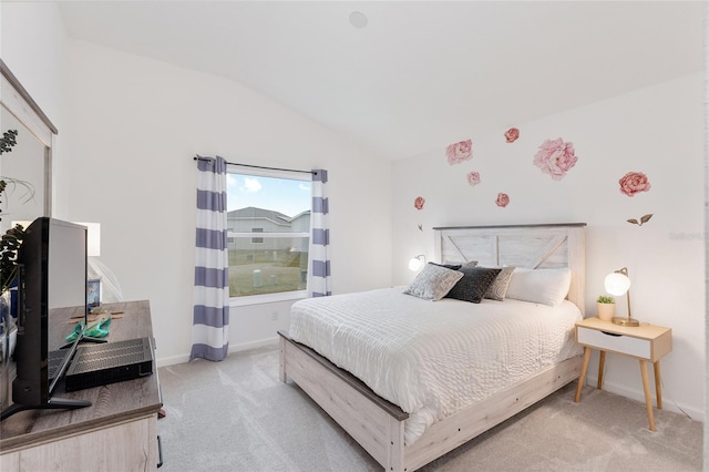 carpeted bedroom featuring vaulted ceiling