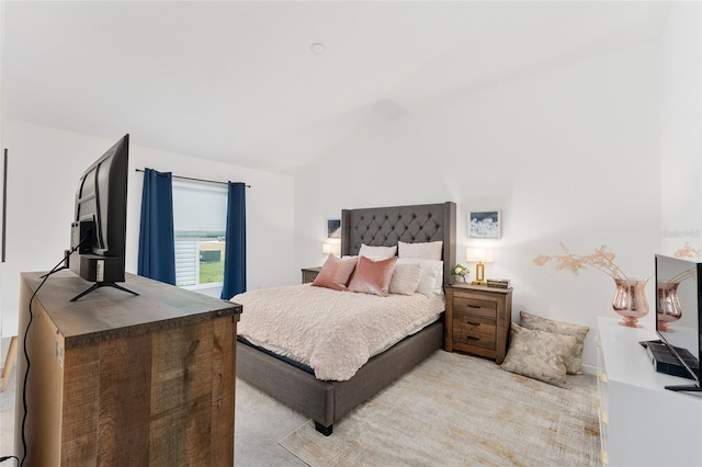 bedroom featuring lofted ceiling