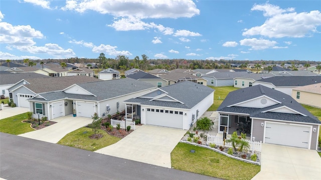 ranch-style house with a front yard and a garage