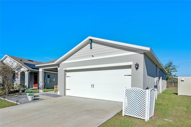 view of front of house featuring a front yard and a garage