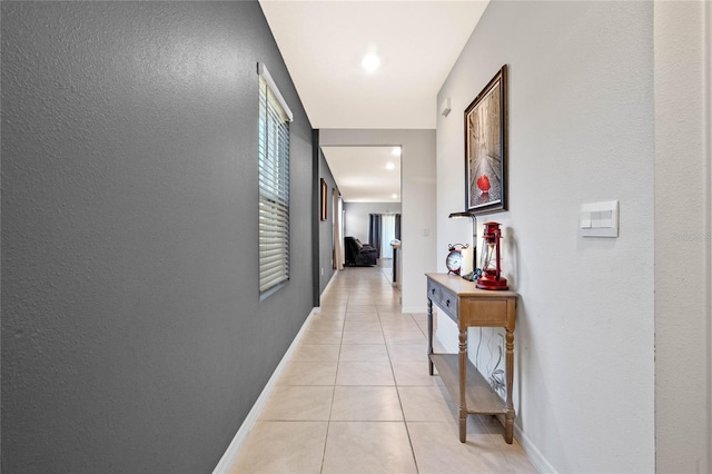 hallway with light tile patterned floors