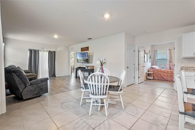 dining area featuring light tile patterned floors and plenty of natural light